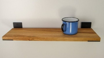 Zwarte plankdragers in boekenplank 1